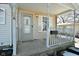 Front porch with white railing and gray door at 502 E 9Th St, Sheridan, IN 46069