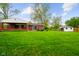 The home has a big backyard, a brick patio, and a storage shed at 56 Hadley Woodland St, Mooresville, IN 46158