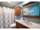 Relaxing full bathroom featuring teal paint, framed mirror, and shower with curtain at 56 Hadley Woodland St, Mooresville, IN 46158