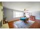 Sunlit dining room featuring hardwood floors, a ceiling fan, and a beautiful area rug at 56 Hadley Woodland St, Mooresville, IN 46158