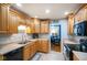 Functional kitchen with ample cabinets, tile floors, and modern appliances at 56 Hadley Woodland St, Mooresville, IN 46158