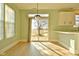 Sunlit dining area featuring hardwood floors and sliding glass doors at 5711 Polk Dr, Noblesville, IN 46062