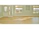 Sunlit living room with hardwood floors and white door at 5711 Polk Dr, Noblesville, IN 46062