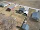 This aerial view highlights the house with a wooden fence surrounding the large yard at 6374 W Friends Wy Ct, Paragon, IN 46166