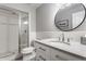 Modern bathroom with subway tile and a large mirror at 7241 Merriam Rd, Indianapolis, IN 46240