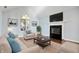 Living room with fireplace, hardwood floors, and neutral furniture at 9110 W Point Dr, Indianapolis, IN 46268