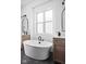 Bright bathroom featuring a soaking tub, dual sink vanities, and modern fixtures at 17368 Pinellas Ave, Westfield, IN 46074