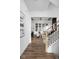 Bright entryway featuring wood floors, a staircase, and an open floor plan at 17368 Pinellas Ave, Westfield, IN 46074