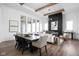 Open-concept living space with a black slat wall fireplace, wood beams, and contemporary furnishings at 17368 Pinellas Ave, Westfield, IN 46074
