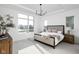 Serene main bedroom with a large window offering neighborhood views and a cozy, neutral color scheme at 17368 Pinellas Ave, Westfield, IN 46074