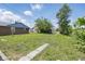 Spacious backyard with lush grass and a pathway, perfect for outdoor activities at 2218 N Arsenal Ave, Indianapolis, IN 46218