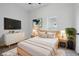 Cozy bedroom with neutral decor, soft lighting, and modern furnishings at 2218 N Arsenal Ave, Indianapolis, IN 46218