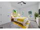 Bright bedroom with modern decor, featuring a comfortable bed and large windows at 2218 N Arsenal Ave, Indianapolis, IN 46218