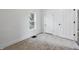 Bright, freshly painted bedroom featuring a new carpet and a window at 2218 N Arsenal Ave, Indianapolis, IN 46218