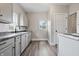 Bright kitchen features gray cabinets, modern fixtures, and durable countertops at 2218 N Arsenal Ave, Indianapolis, IN 46218