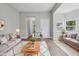 Inviting living room featuring neutral walls, wood floors, and stylish furnishings at 2218 N Arsenal Ave, Indianapolis, IN 46218