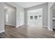 Bright living room featuring new gray vinyl floors, neutral walls, and bay window at 2218 N Arsenal Ave, Indianapolis, IN 46218