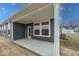 Covered back porch with gray siding and view of the backyard at 3922 Holly Brook Dr, Westfield, IN 46062