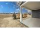 Covered back porch with white columns and a view of the backyard at 3922 Holly Brook Dr, Westfield, IN 46062