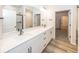 Bathroom featuring a double sink vanity, large mirror, and modern fixtures at 3922 Holly Brook Dr, Westfield, IN 46062
