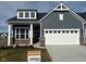 Stunning two-story home with gray siding, white trim, and a two-car garage at 3922 Holly Brook Dr, Westfield, IN 46062