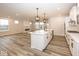 Open concept kitchen with a center island, modern appliances, and a seamless flow to the living area at 3922 Holly Brook Dr, Westfield, IN 46062