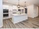 Bright kitchen featuring a central island, stainless steel appliances, and ample cabinet space at 3922 Holly Brook Dr, Westfield, IN 46062