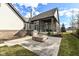 A backyard featuring a built-in fire pit and stainless steel grill, perfect for outdoor entertaining at 520 Bridgemont Ln, Carmel, IN 46032