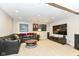 Finished basement with large sectional sofa and TV at 520 Bridgemont Ln, Carmel, IN 46032