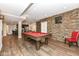 Basement recreation area with pool table and bar at 520 Bridgemont Ln, Carmel, IN 46032