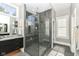 Elegant bathroom featuring a spacious shower and dark cabinetry at 520 Bridgemont Ln, Carmel, IN 46032