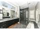 Modern bathroom with a large walk-in shower and granite countertops at 520 Bridgemont Ln, Carmel, IN 46032