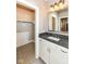 Simple bathroom with a vanity and walk-in closet at 520 Bridgemont Ln, Carmel, IN 46032