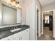 Bathroom with granite countertop and large mirror at 520 Bridgemont Ln, Carmel, IN 46032