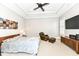 Spacious bedroom with large bed, seating area, and mounted TV at 520 Bridgemont Ln, Carmel, IN 46032