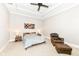 Serene bedroom with a cozy bed and a leather chair at 520 Bridgemont Ln, Carmel, IN 46032