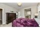 Bedroom with dark wood furniture and purple blanket at 520 Bridgemont Ln, Carmel, IN 46032