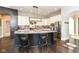 Modern kitchen with granite countertops and dark cabinetry at 520 Bridgemont Ln, Carmel, IN 46032