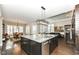 Large kitchen island with granite countertop and seating at 520 Bridgemont Ln, Carmel, IN 46032