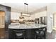 Modern kitchen with curved island and stainless steel appliances at 520 Bridgemont Ln, Carmel, IN 46032
