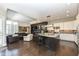 Open concept kitchen with island and stainless steel appliances at 520 Bridgemont Ln, Carmel, IN 46032