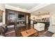 Open concept living room with kitchen view and a cozy fireplace at 520 Bridgemont Ln, Carmel, IN 46032