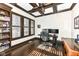 Home office with built-in shelving and hardwood floors at 520 Bridgemont Ln, Carmel, IN 46032