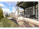 This covered patio features a dining table and chairs, perfect for enjoying outdoor meals at 520 Bridgemont Ln, Carmel, IN 46032