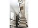 Grand staircase with herringbone patterned carpet runner at 520 Bridgemont Ln, Carmel, IN 46032