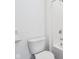 Bathroom featuring toilet, tub/shower combo, and white walls at 7840 Magnolia St, New Palestine, IN 46163