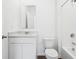 Bathroom featuring granite vanity top, white cabinets, and tub/shower combo at 7840 Magnolia St, New Palestine, IN 46163