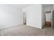 A cozy bedroom features neutral carpet and fresh white walls at 7840 Magnolia St, New Palestine, IN 46163