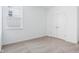 An inviting bedroom featuring neutral carpet, white walls, and a window to let the natural light in at 7840 Magnolia St, New Palestine, IN 46163