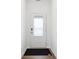 Welcoming entryway showcasing a clean, simple design with hardwood floors and a modern door at 7840 Magnolia St, New Palestine, IN 46163